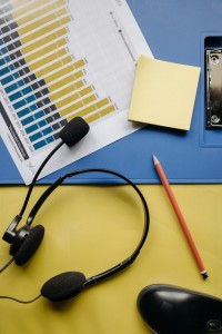 black-and-orange-microphone-on-white-paper