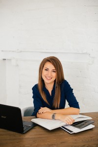 woman-in-blue-long-sleeve-shirt-sitting-on-chair