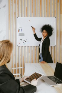 woman-pointing-at-whiteboard
