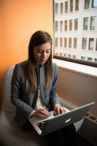 photo-of-woman-sitting-on-chair-and-typing-on-silver-macbook-1181547